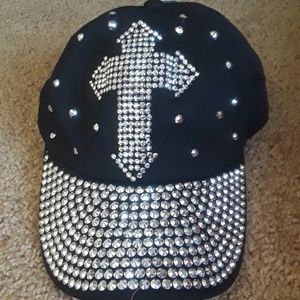 Rhinestone cross black hat.